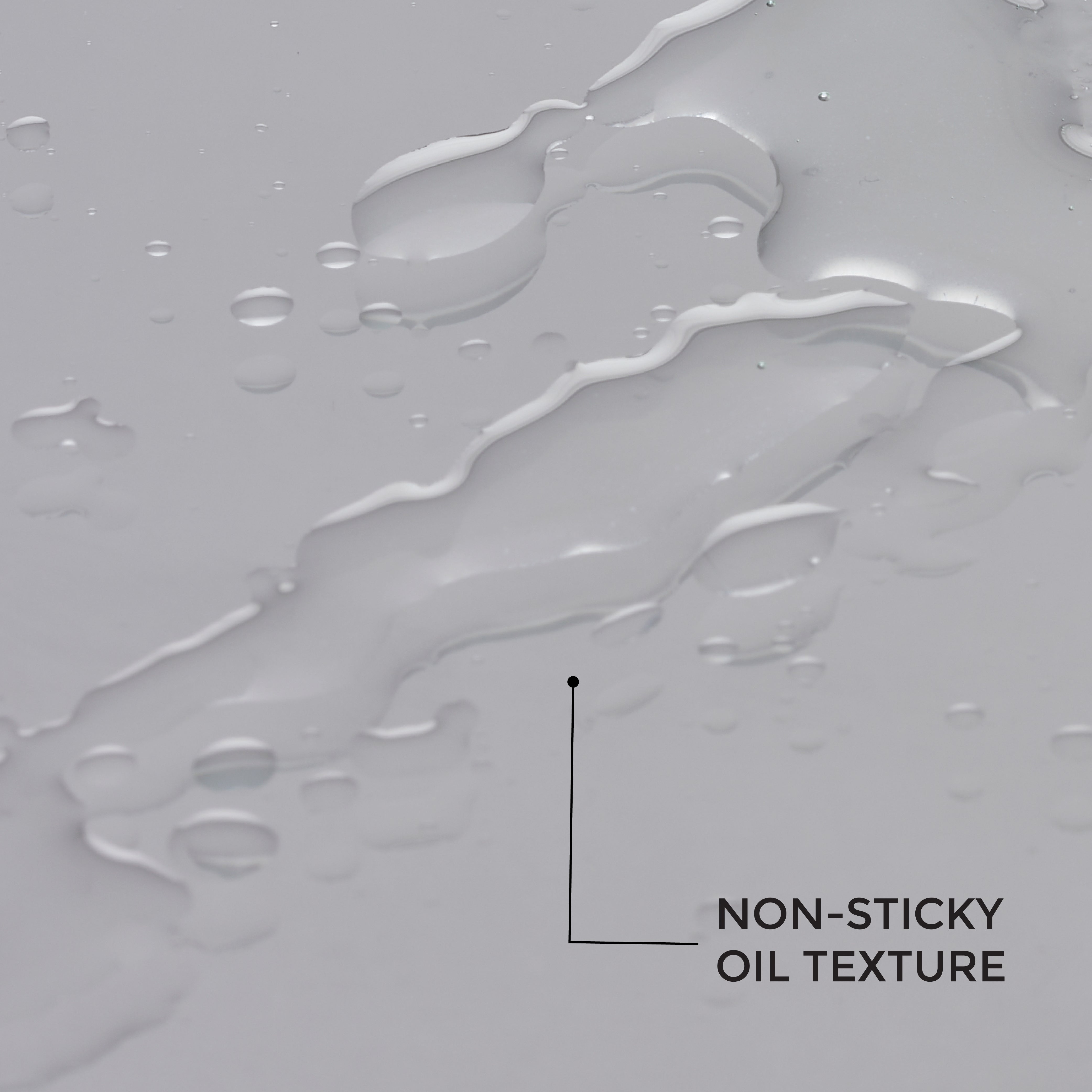 Close‑up of Bravado B‑Gro Beard Growth Oil texture — nourishing beard oil drops