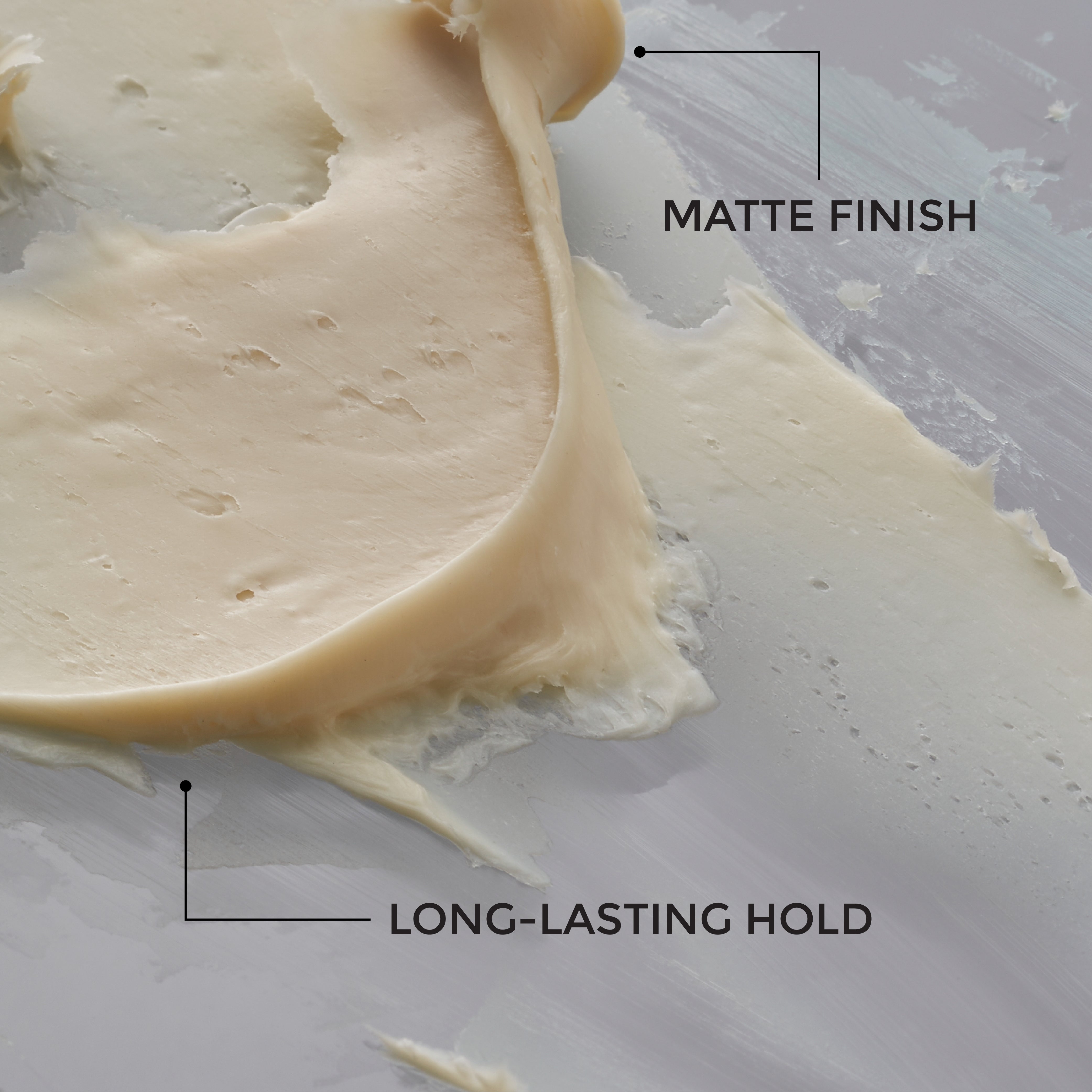 Close-up of Artist Hair Pomade texture — solid pomade wax consistency